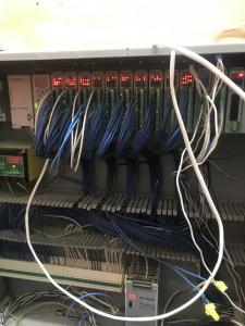 carefully organized equipment rack with many cables